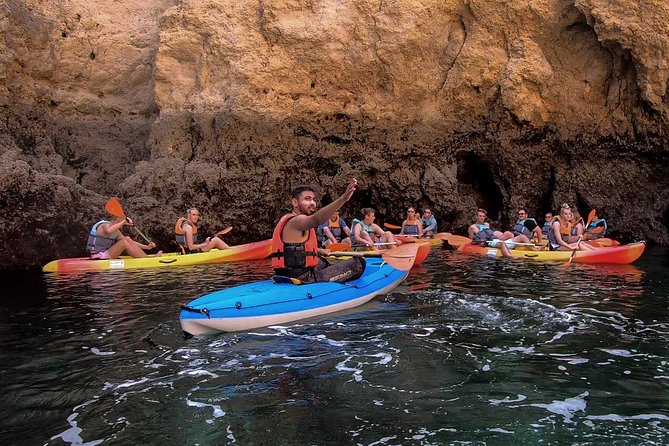 2-hour Kayak Tour of Ponta da Piedade Caves and Beaches - Returning to the catamaran for a swim