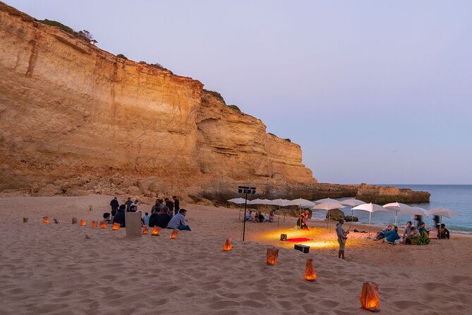 Albufeira: 6-Hour Sunset Dinner Catamaran Cruise with Open Bar - Following the Algarve cliffs toward Benagil