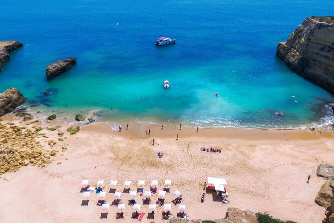 Albufeira Beach BBQ with Caves and Coastline Cruise with Open Bar - Cruising the Algarve cliffs toward Benagil