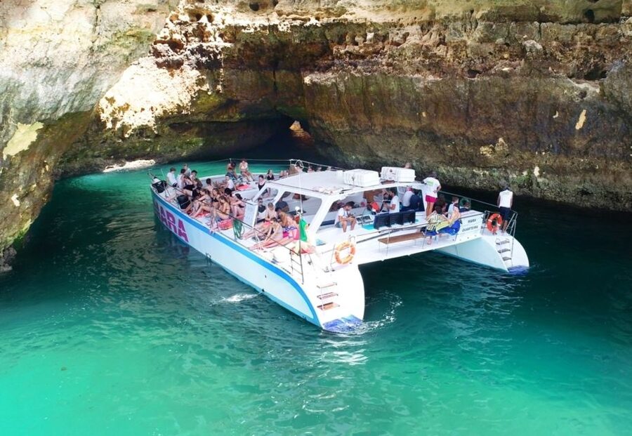 Albufeira: Caves and Coastline Catamaran Cruise to Benagil - The swimming stop and life on deck