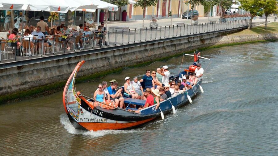 Aveiro: Traditional Moliceiro Boat Cruise - Reading Aveiro from the canals