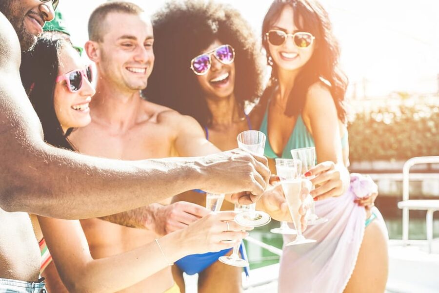 Boat Party to the Beach with Swimming Stops, DJ and Open Bar - Leaving Lisbon with a drink in hand