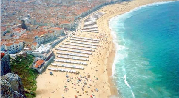 From Lisbon: Fátima, Batalha, Nazaré and Óbidos Day Tour - Nazaré for the beach, fishermen’s houses, and cliff views