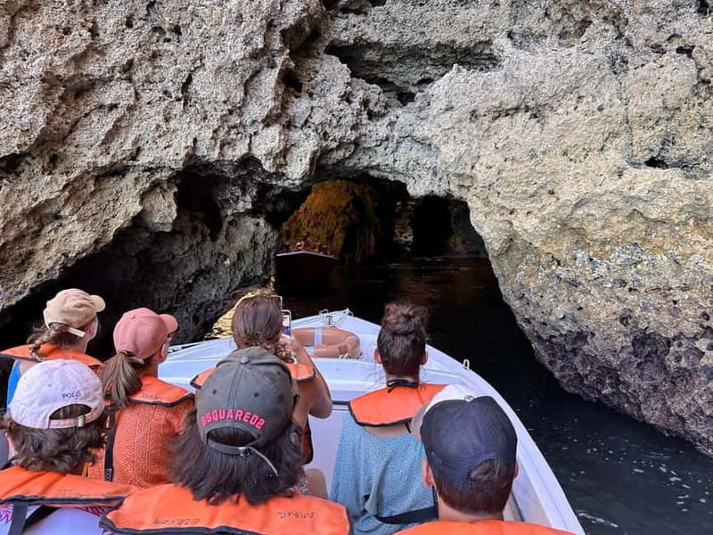 Lagos: Ponta da Piedade Caves Boat Tour - Entering the caves in a nine-person boat