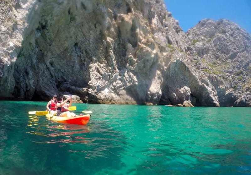 Lisbon: Arrabida Park Kayak Tour with Beach Picnic - Paddling below Arrábida’s limestone cliffs