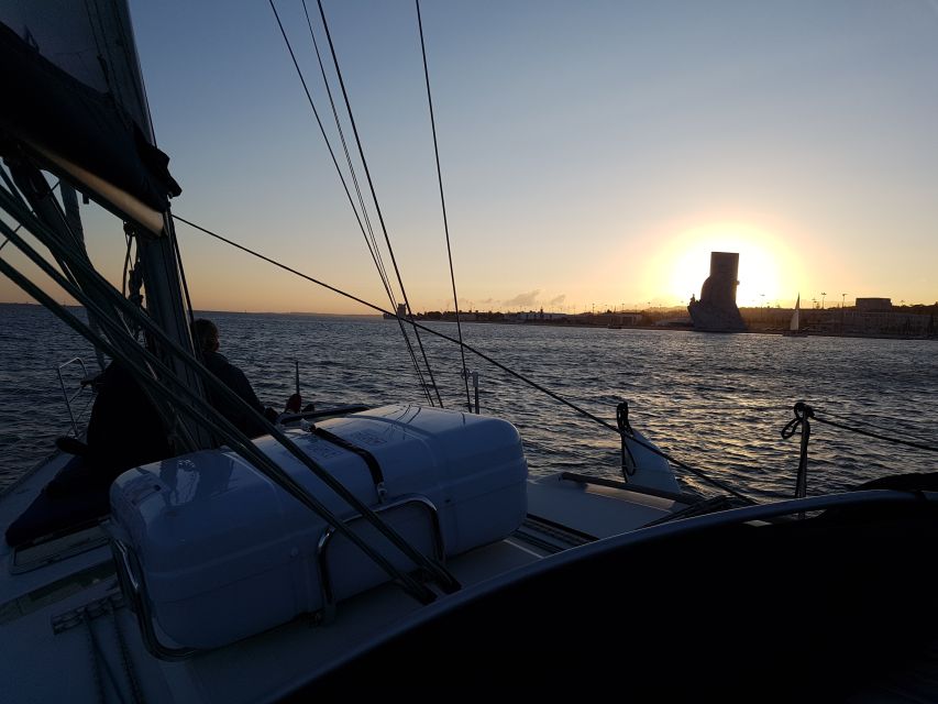 Lisbon: City Skyline Sailboat Cruise with Drink and Snacks - Under the 25 de Abril Bridge and Toward Belém