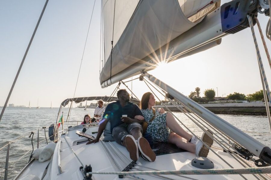 Lisbon: Daytime/Sunset/Night City Sailboat Tour with Drink - Under the 25 de Abril Bridge Toward Almada