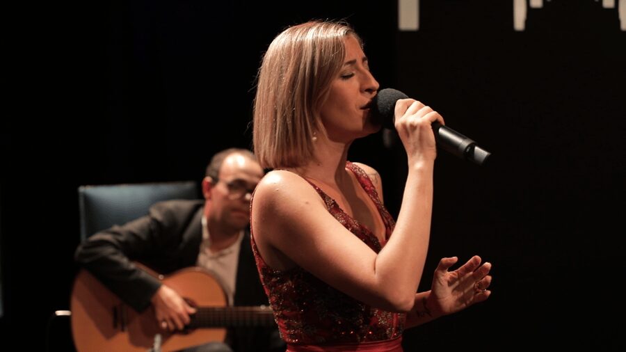 Lisbon: Fado in Chiado Live Show - Lisbon on the screen behind the performers