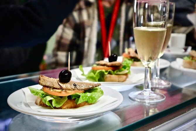 Lisbon Food Tour with 10+ Tastings of Local Delicacies & Wines - Baixa, Santa Justa, and the Classic Lisbon View