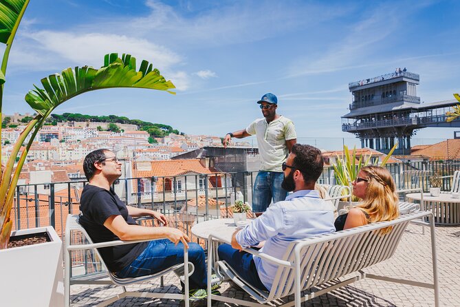 Lisbon Hidden Gems Walk: Traditions, Lunch and Ferry ride - Seafood rice, bread, and green wine