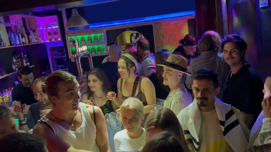 Lisbon Pub Crawl: Unlimited Drinks, Shots & V.I.P Club Entry - Walking through Bairro Alto