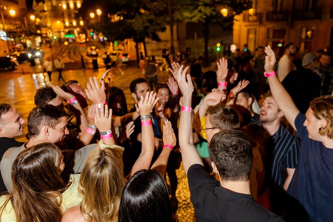 Lisbon: Pub Crawl with Open Bar, Shots & VIP Club Entry - Walking the Hills Toward Pink Street