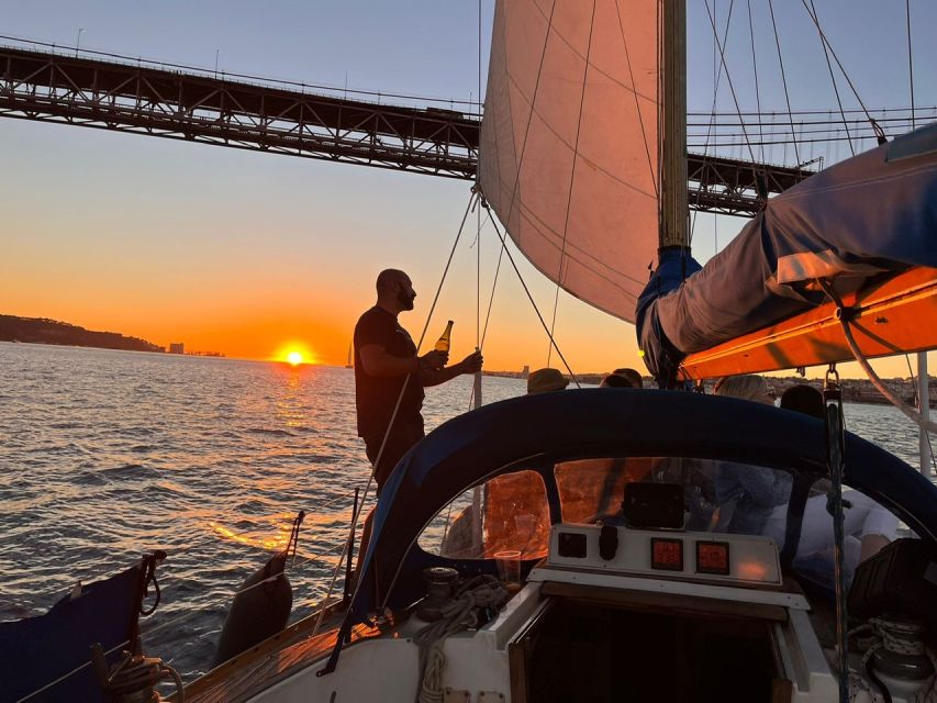 Lisbon: Sailboat Sunset Tour with a Drink - Drinks, snacks, and the onboard mood