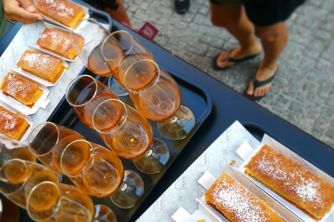 Lisbon Small-Group Food Tour with 18 Tastings in Alfama District - Starting above the rooftops at Portas do Sol