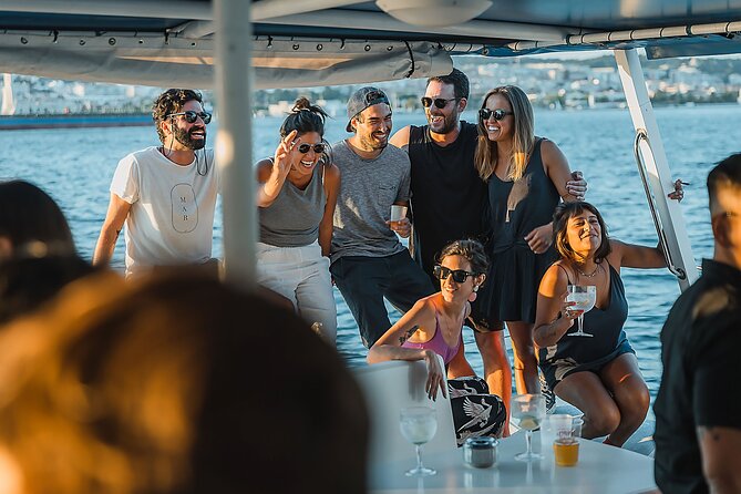 Lisbon: Sunset Catamaran Boat Tour with Music and Drinks - Cristo Rei brings the south bank into view