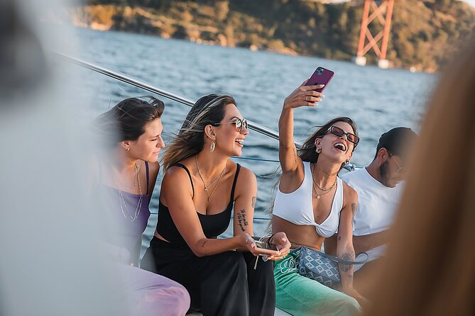 Lisbon: Sunset Catamaran Boat Tour with Music and Drinks - The Discoveries monument and Jerónimos Monastery
