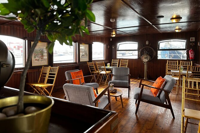 Lisbon: Sunset on board with music & drinks - Christ the King and the 25 de Abril Bridge