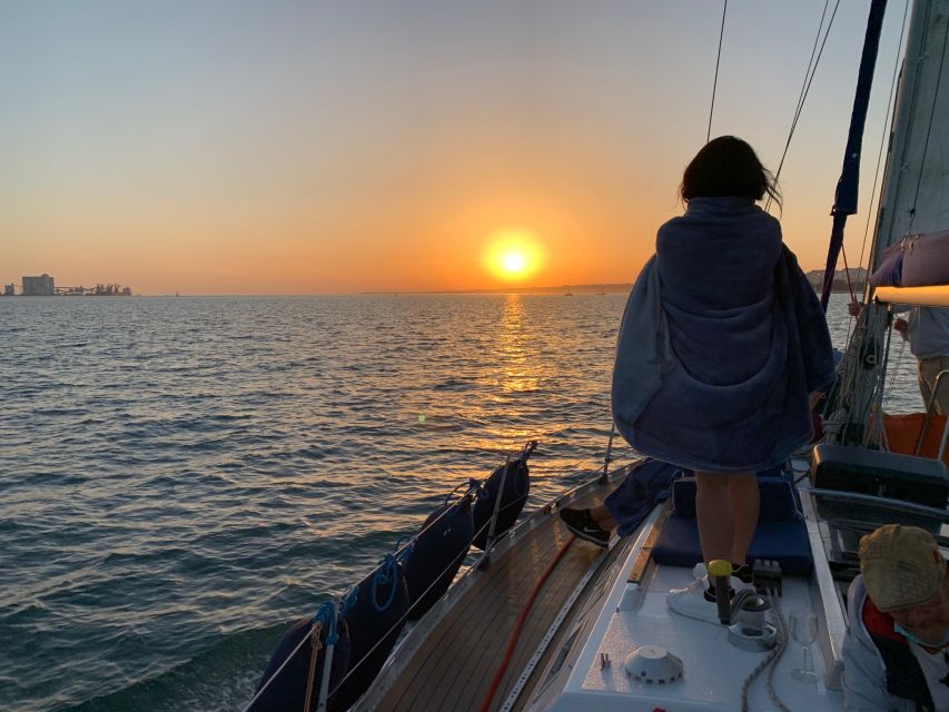 Lisbon: Sunset Sailing Cruise with Wine - Sunset, wine, and the changing mood onboard