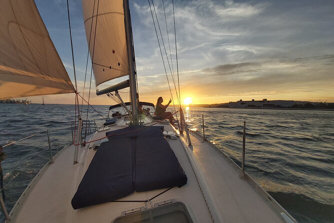 Lisbon: Sunset Sailing with Portuguese Wine and History - Under the 25 de Abril Bridge