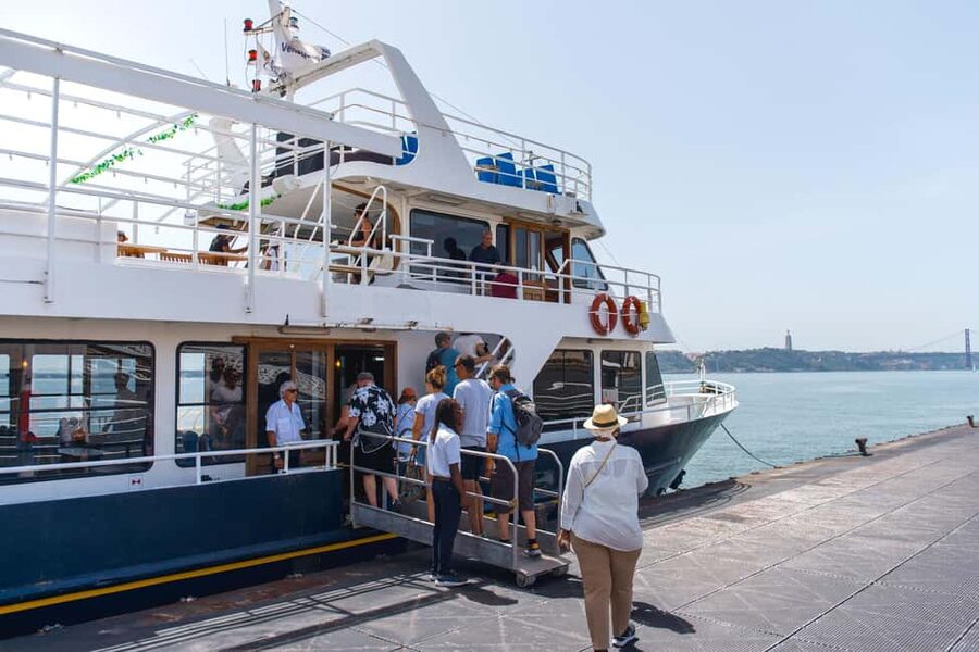 Lisbon: Tagus River Boat Tour with One Drink Included - Audio guide, seating, and onboard comfort