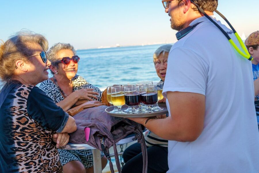 Lisbon: Tagus River Sunset Tour with Snacks and Drink - Passing beneath the 25th of April Bridge