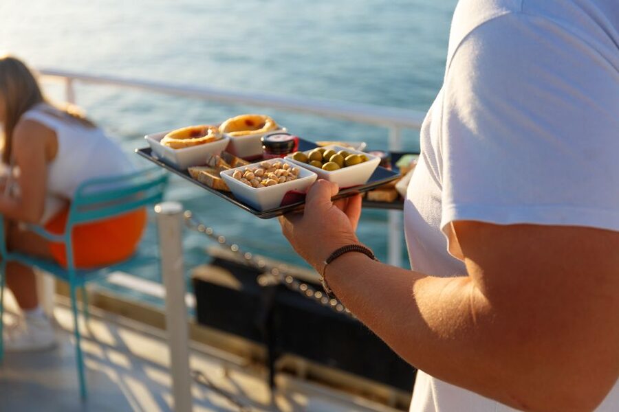 Lisbon: Tagus River Sunset Tour with Snacks and Drink - Christ the King across the water