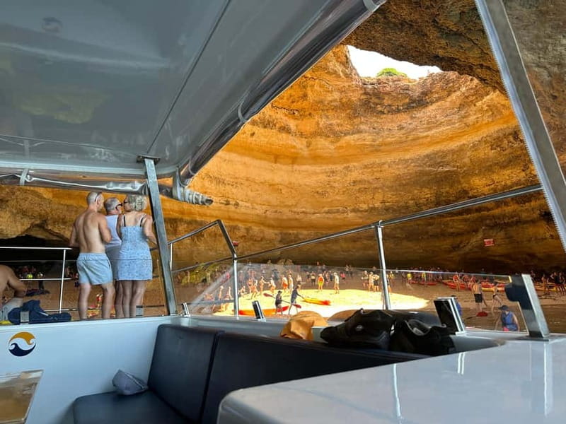 Portimão: Benagil Caves & Golden Coast Eco Catamaran Tour - Entering Benagil Cave and the smaller sea caves