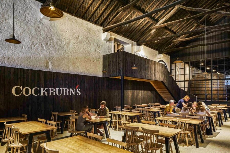 Porto: Cockburn’s Port Lodge Tour and Tasting - Follow the barrels into the ageing gallery