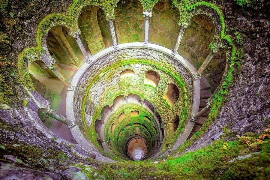 Sintra: Quinta da Regaleira Entry Ticket and Guided Tour - Following the paths through gardens, lakes, and grottoes